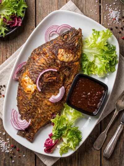Spicy-Tilapia-with-fried-yam-chips-or-jollof-rice-or-banku at aircuisinedishes